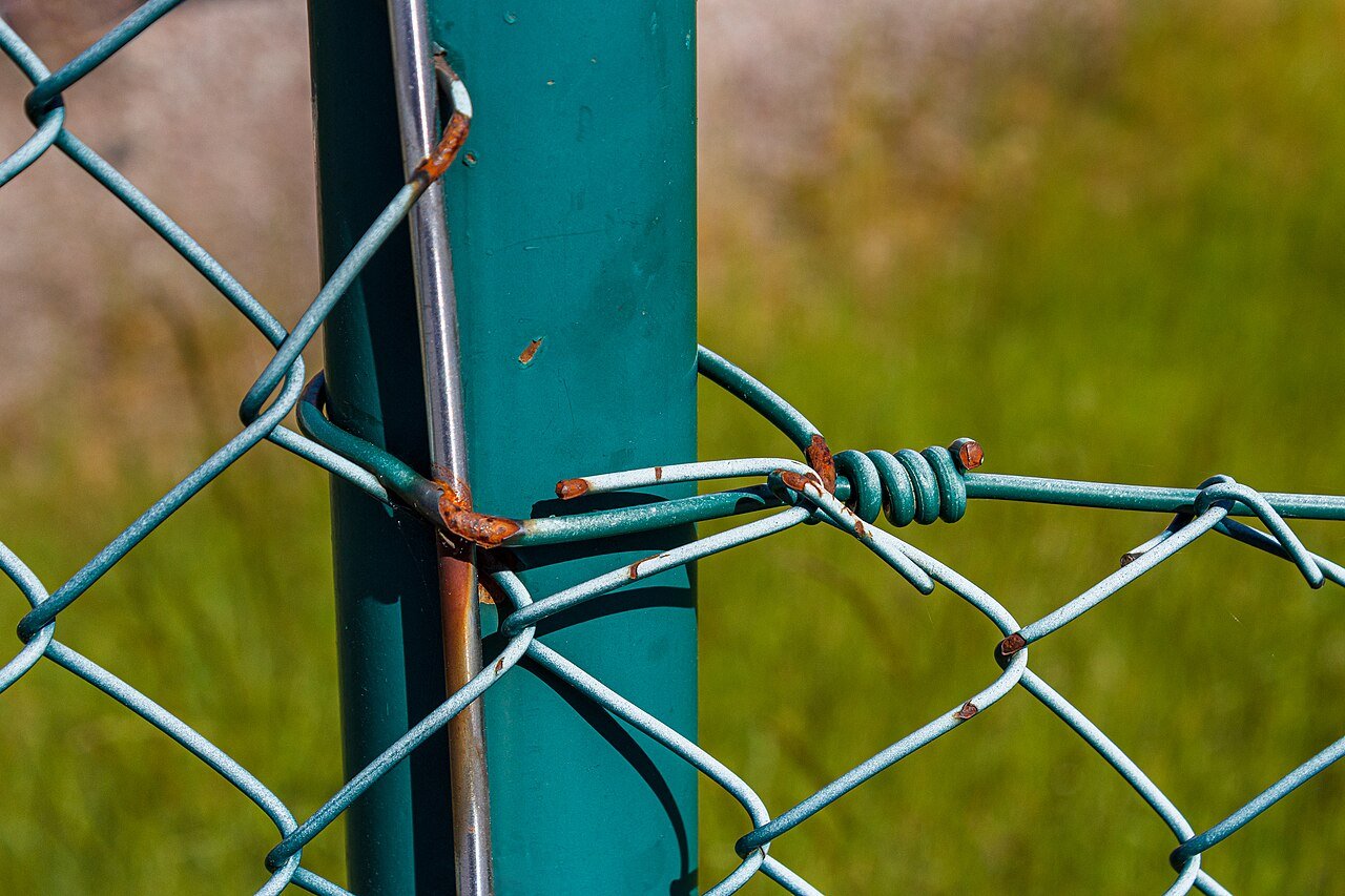 Part of green chain-link fence In Tuntorp